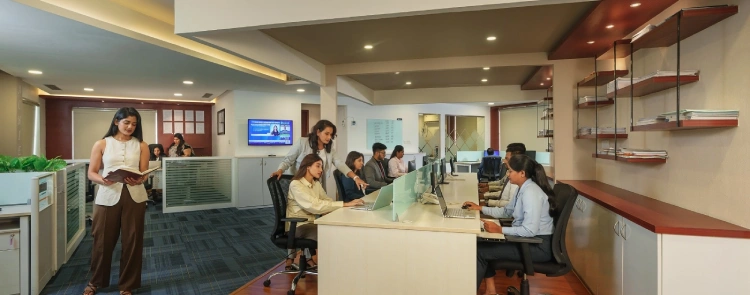 AssetZ team working collaboratively in a modern office setting